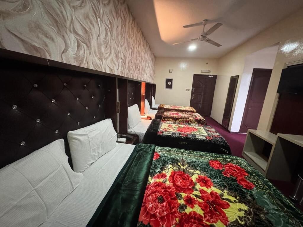 Deluxe Quadruple Room, City View | Desk, laptop workspace, iron/ironing board, free WiFi