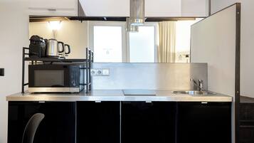 Apartment, Multiple Beds | Private kitchen | Mini-fridge, microwave, stovetop, dishwasher