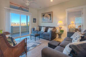 Smart TV, books - Experience beachside bliss at Fountains Folly, a spacious 4-bedroom home in Oak Island. (Oak Island)