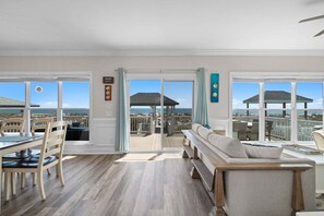 TV, fireplace - Experience beachfront luxury at the Resolute, a spacious 4-bedroom escape in Oak Island. (Oak Island)