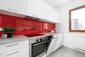 Fridge, microwave, oven, stovetop - Bright Apartment with Bedroom | Workspace (Kraków)