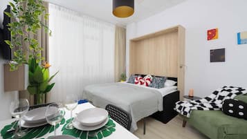 Een strijkplank/strijkijzer, reisbedje, wifi, beddengoed