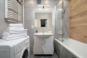 Shower, hair dryer, towels, shampoo