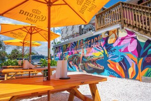 A vibrant mural with a crocodile and the word 'MAD BEACH' on a building. - Modern & Quiet Oasis, 1 minute walk to the Beach (Madeira Beach)