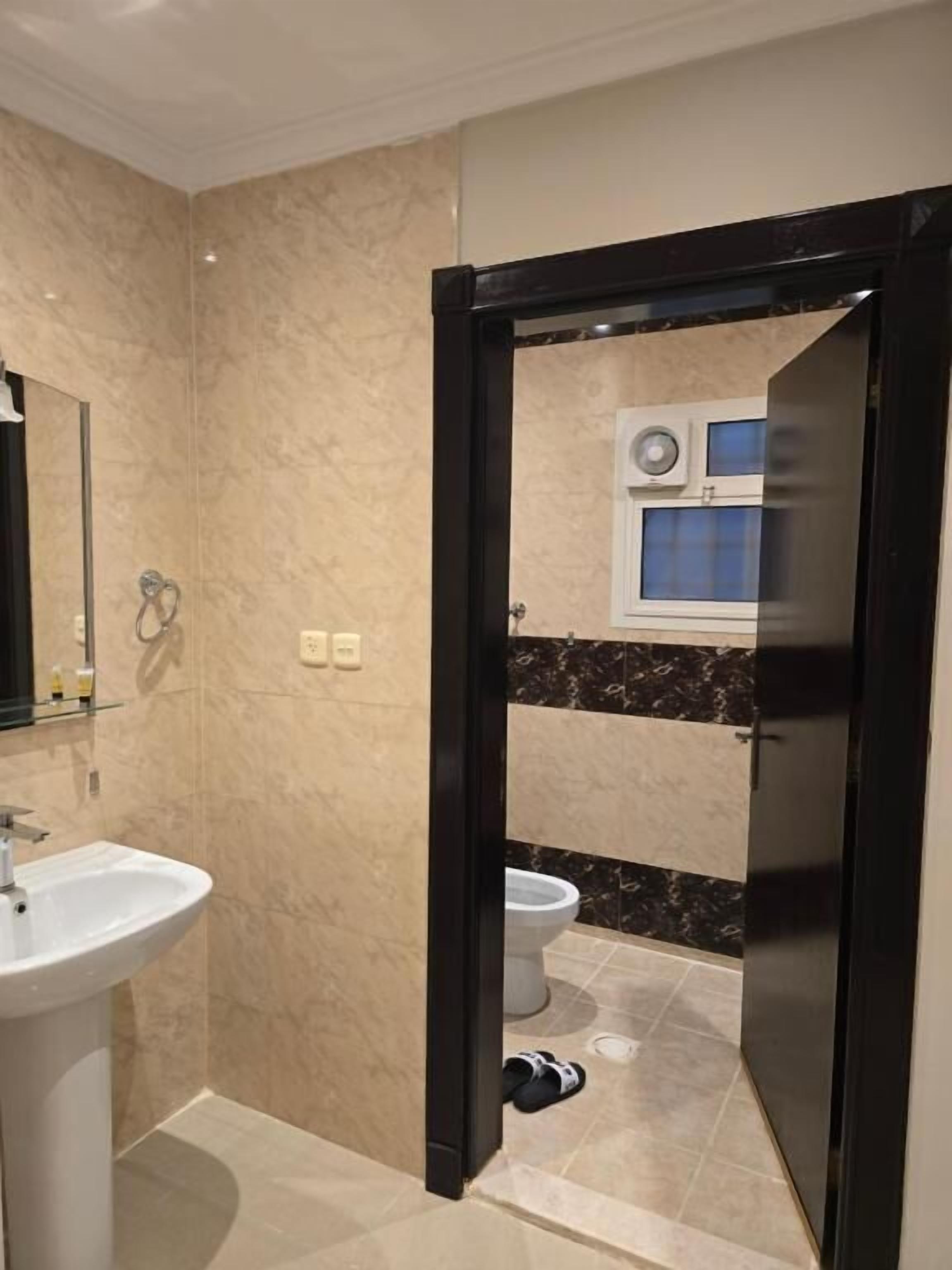 Shower, slippers, towels, soap