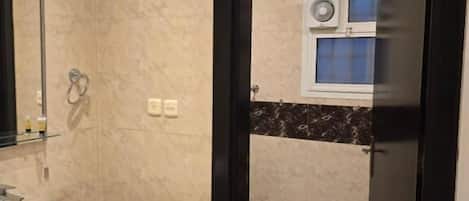 Shower, slippers, towels, soap