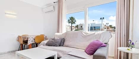 Comfort Apartment, Balcony, Partial Sea View | Living area | TV