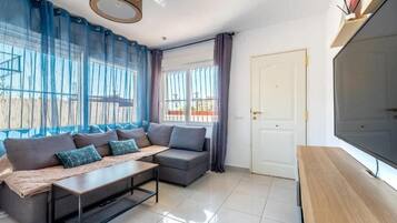 Appartement Deluxe, vue cour intérieure | Coin séjour