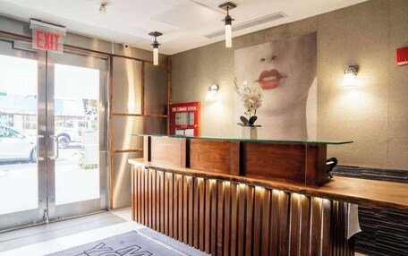A reception desk with a glass top, wooden paneling, and a 'Fire Command Station' sign.