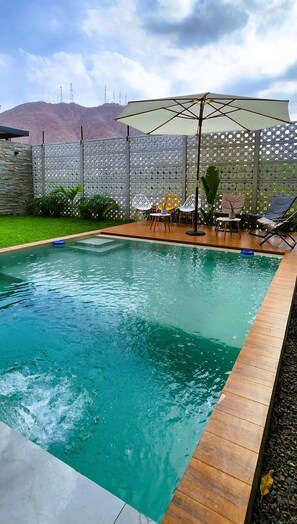 A swimming pool with a wooden deck, a covered seating area, and a decorative fence. - w Private 4BR Getaway With Pool Cinema (Salas)