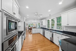 Fridge, microwave, oven, stovetop - Wake up to breathtaking waterfront views in this beautifully designed retreat with spacious rooms for everyone. Private dock, stunning deck & complimentary kayaks. Walk to Wickford Village shops, restaurants & coastal charm. (North Kingstown)