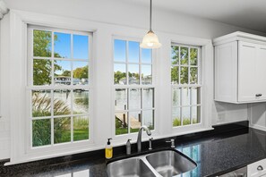 Interior - Wake up to breathtaking waterfront views in this beautifully designed retreat with spacious rooms for everyone. Private dock, stunning deck & complimentary kayaks. Walk to Wickford Village shops, restaurants & coastal charm. (North Kingstown)