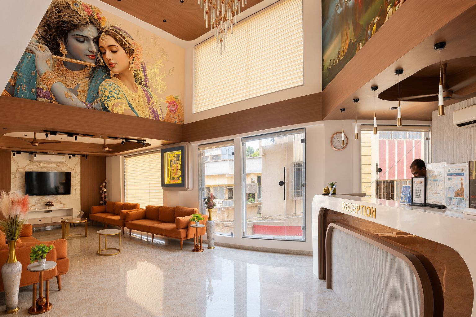 A hotel lobby with a reception desk, seating area, and a mural on the wall.