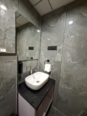 Shower, slippers, towels, soap - White Panda Hotels Shree Radhe (Dwarka)