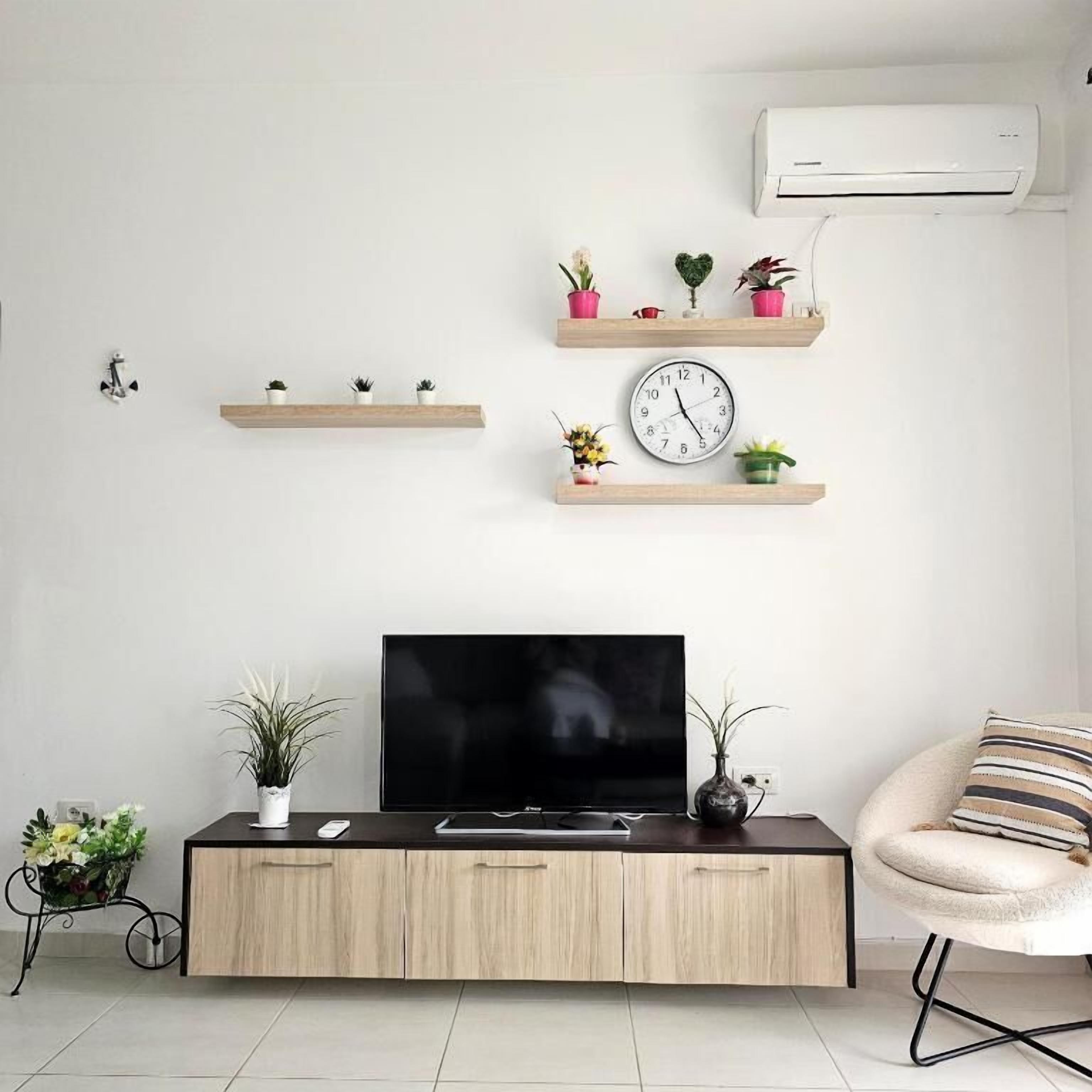 Televisión de pantalla plana de 42 pulgadas con canales por cable