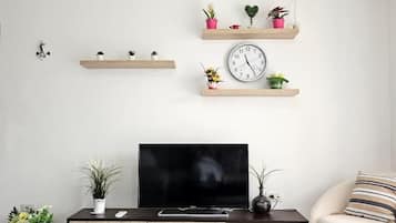 Televisión de pantalla plana de 42 pulgadas con canales por cable