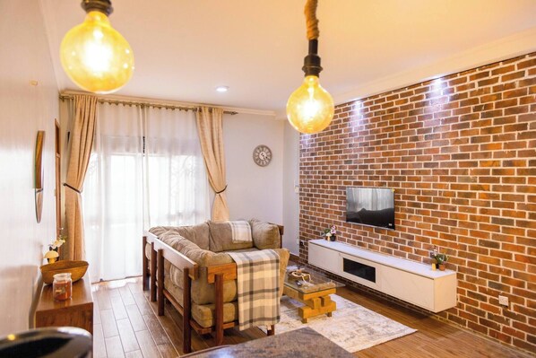 Living room - Charming 2-bedroom Apartment in Bwebajja, Kampala (Entebbe)