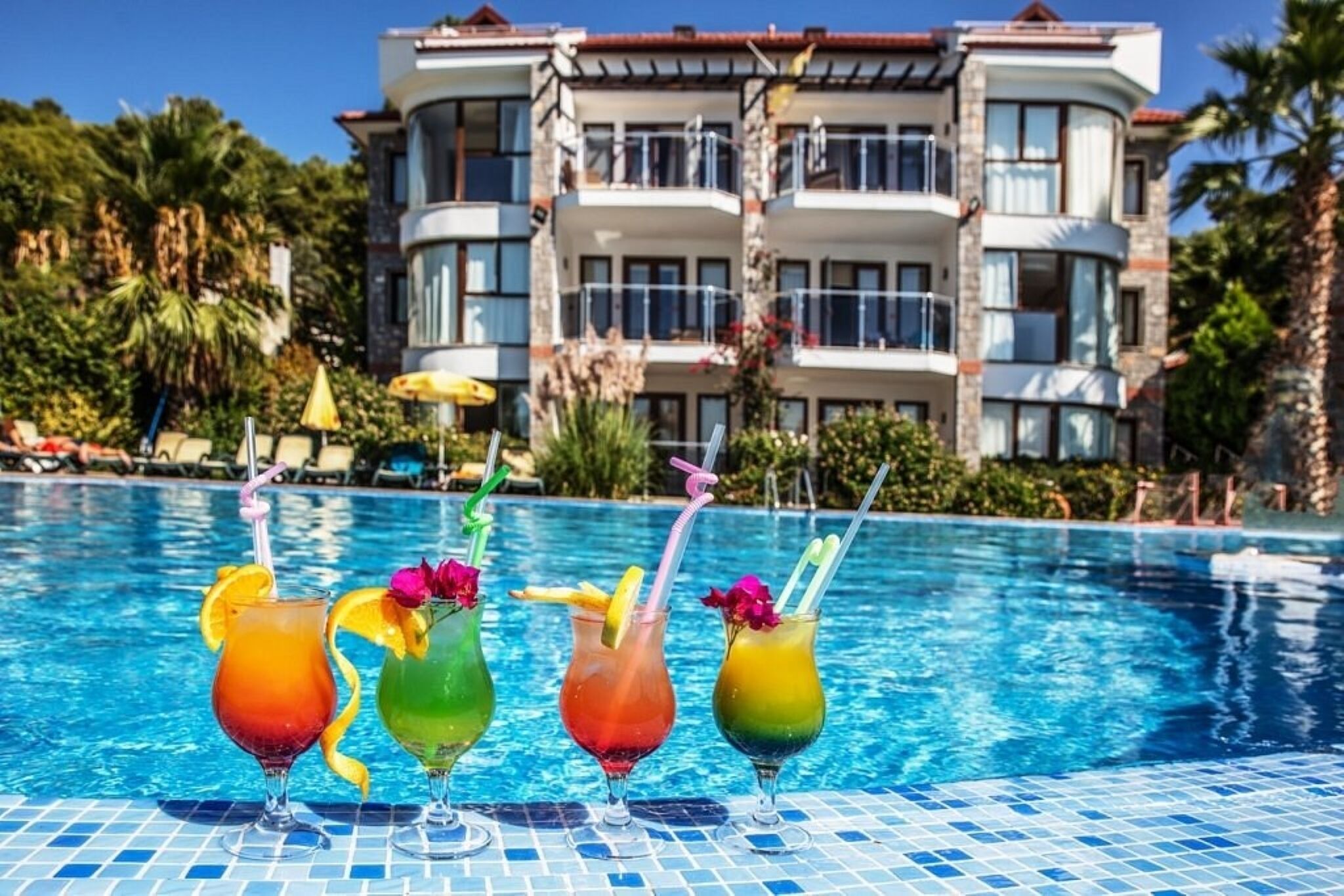 Seasonal outdoor pool, open 9:00 AM to 7:00 PM, pool umbrellas