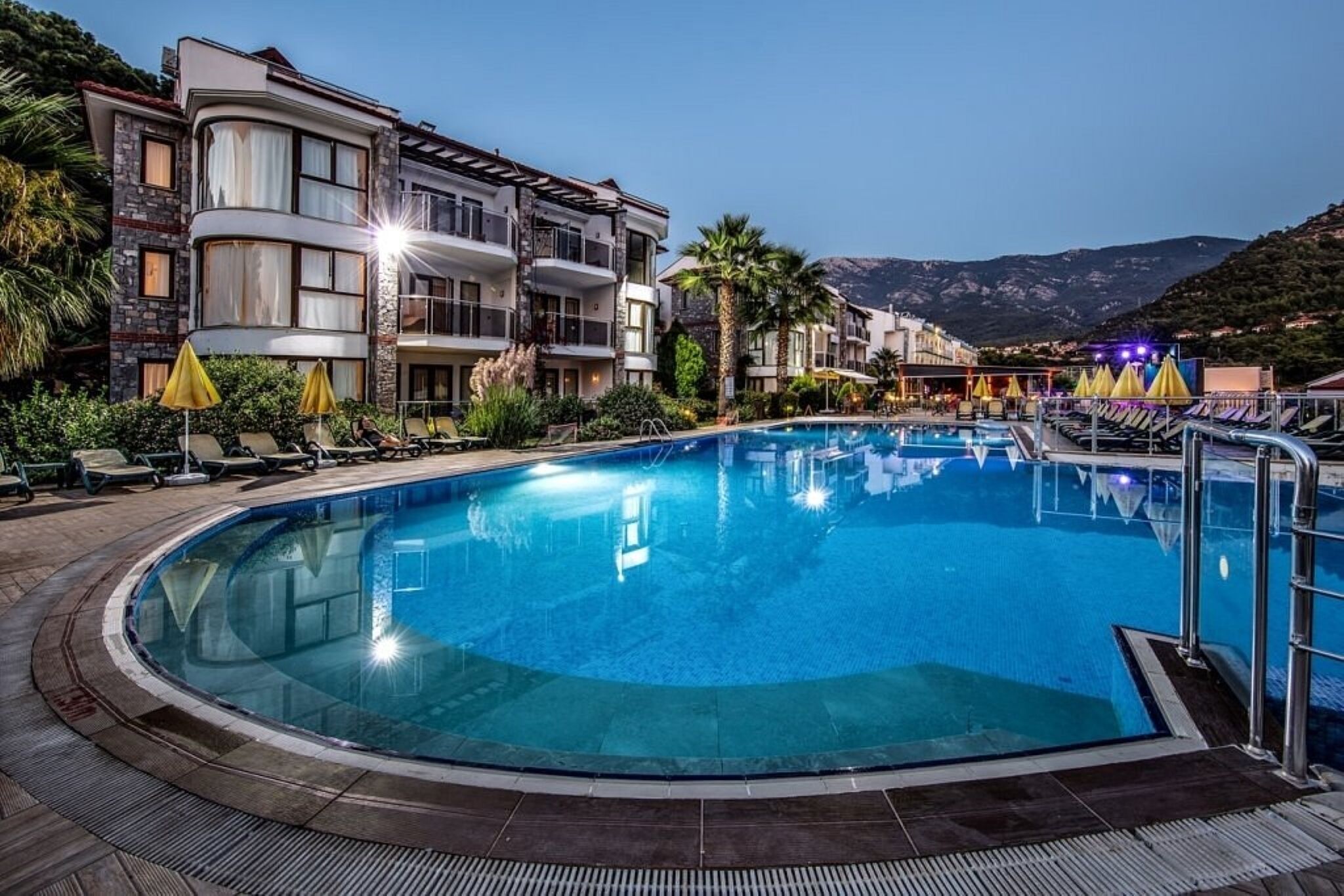 Seasonal outdoor pool, open 9:00 AM to 7:00 PM, pool umbrellas