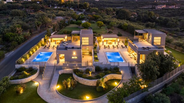 A modern two-story house with a swimming pool, outdoor seating, and a well-maintained garden. - IMPERIUM LUXURY VILLAS (Chania)