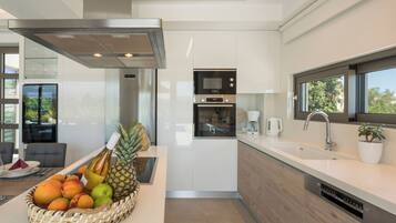 Full-sized fridge, microwave, espresso maker, coffee/tea maker