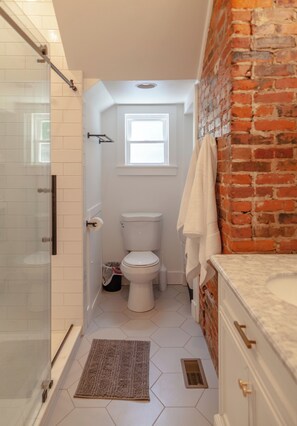 Shower, hair dryer, towels, soap