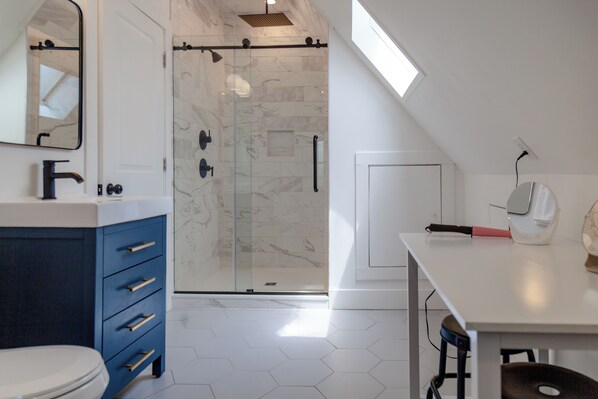 Shower, hair dryer, towels, soap