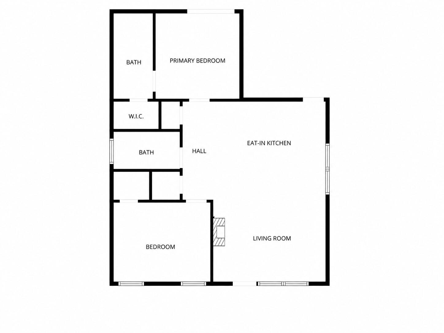 A floor plan with a primary bedroom, two bathrooms, a W.C., a hall, an eat-in kitchen, a living room, and a bedroom.