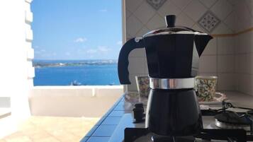 Full-sized fridge, oven, dishwasher, cookware/dishes/utensils