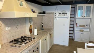 Comfort Loft, Balcony, Sea View | Private kitchen | Full-sized fridge, oven, dishwasher, cookware/dishes/utensils