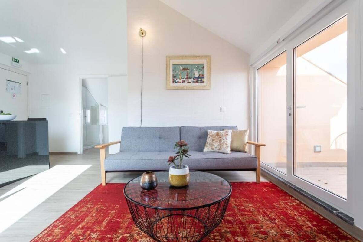Premium Penthouse, Balcony, River View | Living area | TV, toys, printers