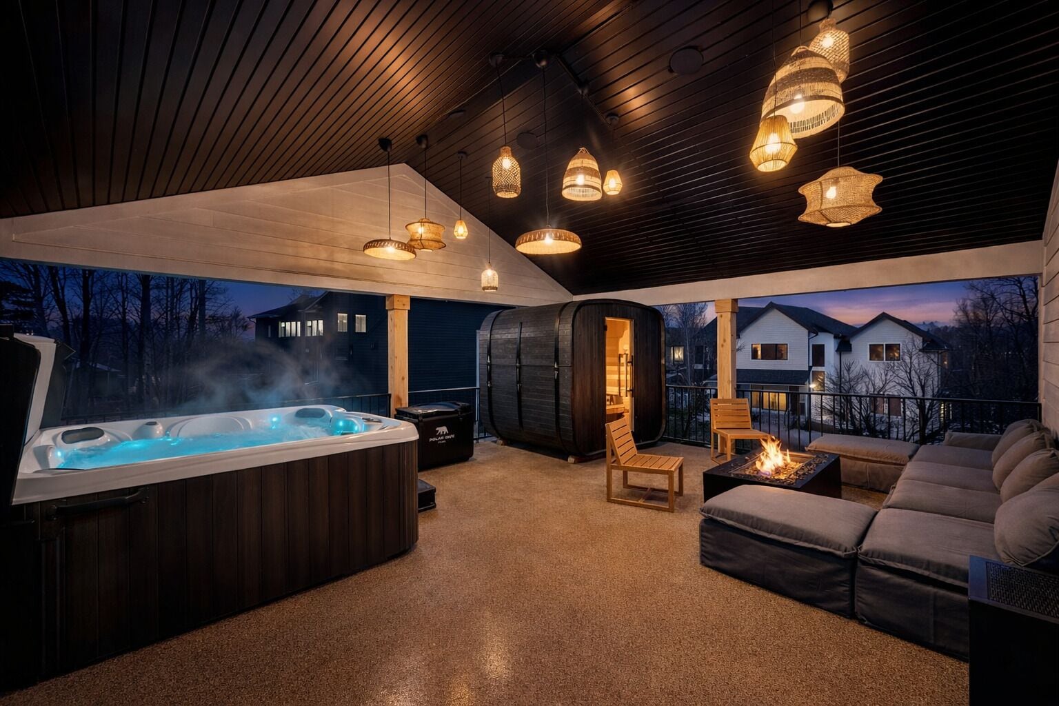 A hot tub area with a view of houses, wooden ceiling, and hanging lights.