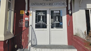 The entrance to Lanayr Hotel with a sign indicating the reception area. - Lanayr Hotel Blackpool Limited (Blackpool)