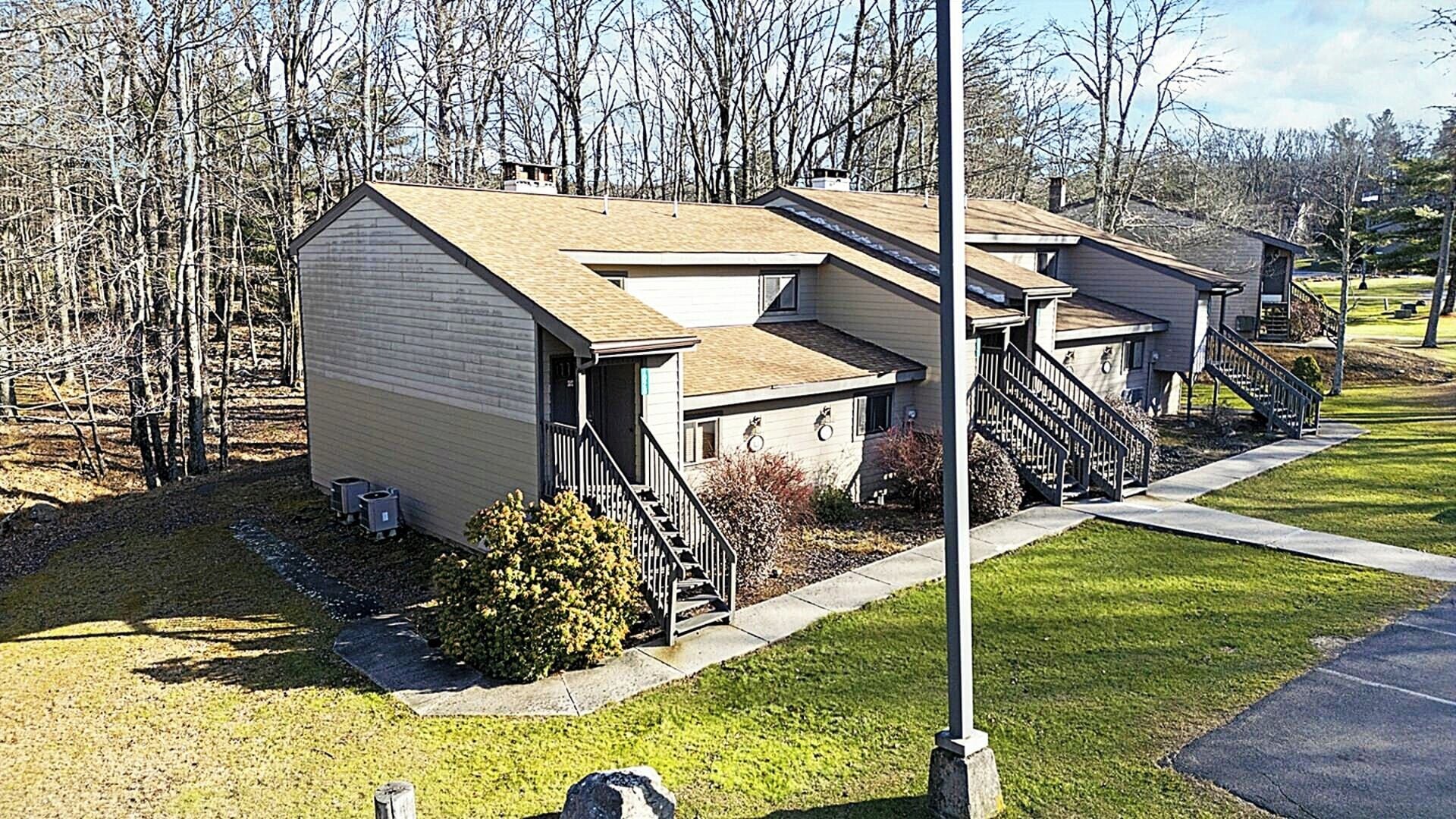 A row of small, single-story buildings with a simple, functional design, likely serving as residential units or small apartments.