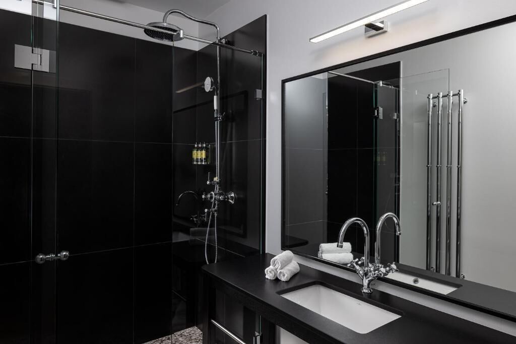 Shower, designer toiletries, hair dryer, towels