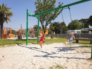 A playground with swings and climbing structures. - Gildas - Privilège 4 - 8p (Préfailles)