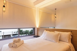 Apartamento conforto, vista para a cidade | Cortinas blackout, ferros/tábuas de passar roupa, Wi-Fi de cortesia