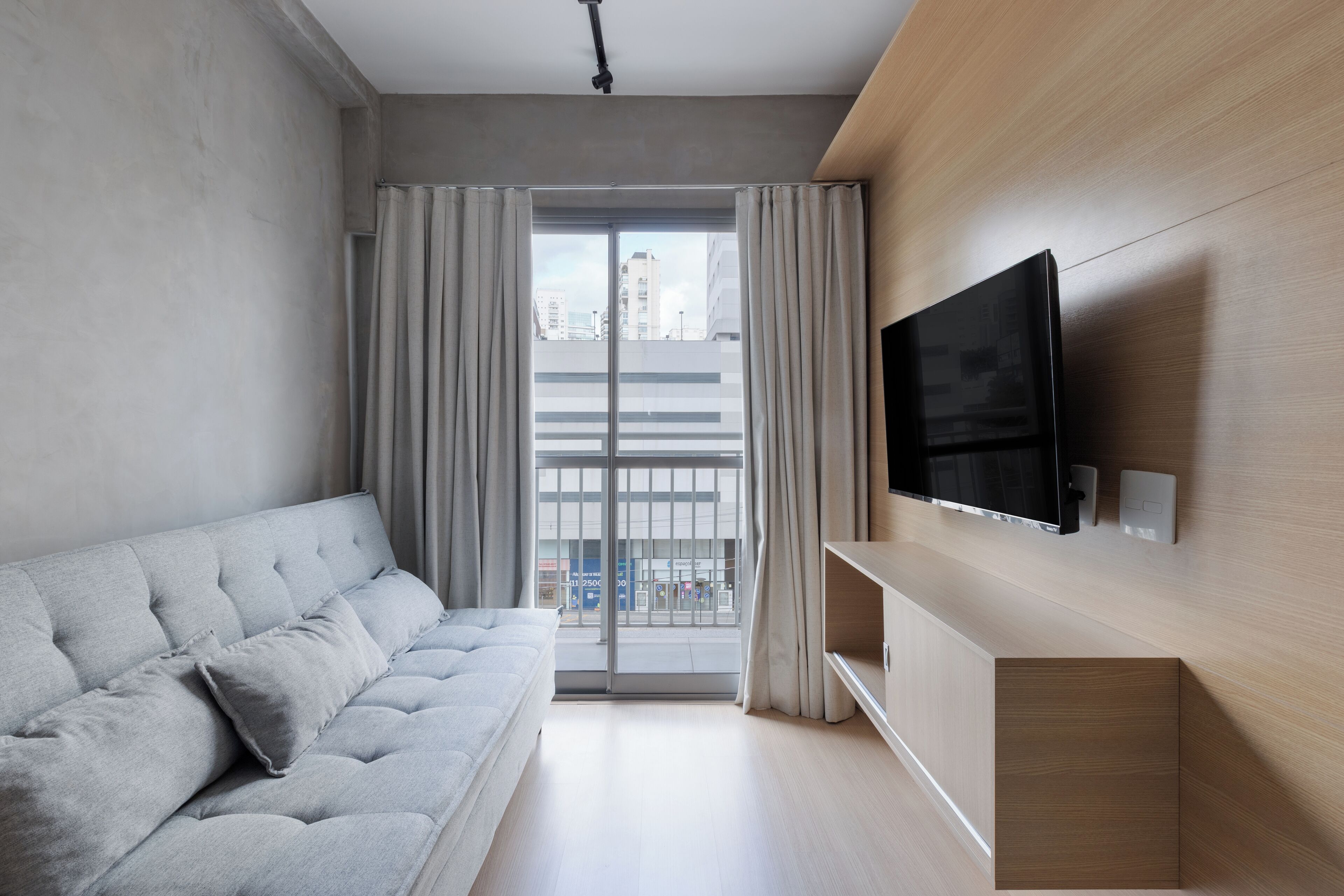 Apartamento conforto, vista para a cidade | Área de estar