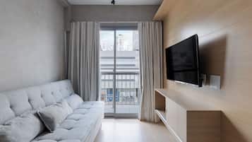 Apartamento conforto, vista para a cidade | Área de estar