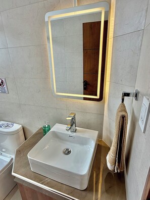 Shower, hair dryer, towels, soap