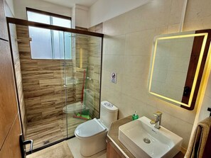 Shower, hair dryer, towels, soap