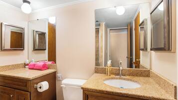 Shower, towels, soap, toilet paper