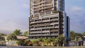 A modern high-rise building with multiple balconies and a flat facade. - Haus Mitre Vila Clementino by Wecare (São Paulo)