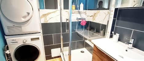 Shower, hair dryer, towels, toilet paper