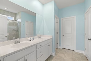 Shower, hair dryer, towels, shampoo