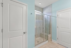 Shower, hair dryer, towels, shampoo