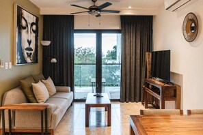 TV, offices - Chic Condo Steps to Beach w Rooftop Pool and Parking (Playa del Carmen)