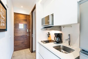 Fridge, microwave, stovetop, coffee/tea maker