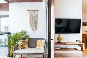 TV, offices - Stylish Condo w Rooftop Pools and Ocean Views (Playa del Carmen)