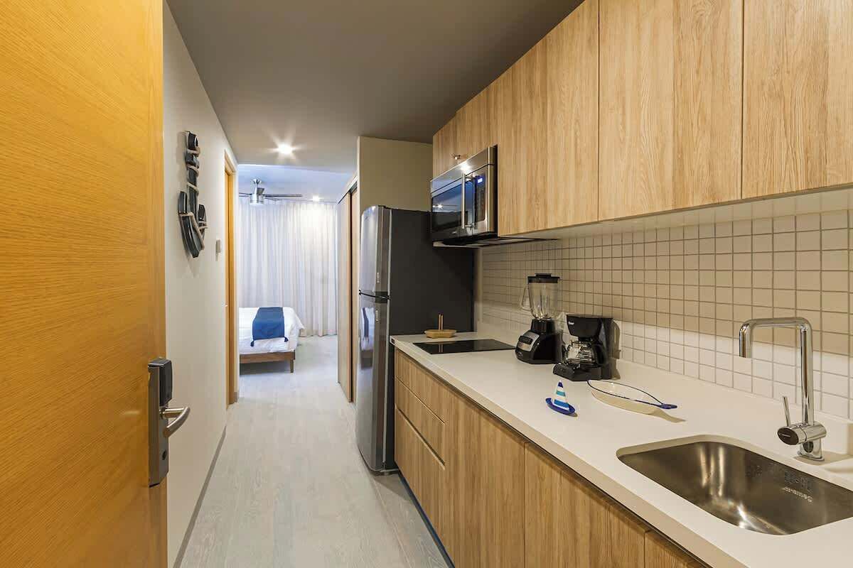 Fridge, microwave, stovetop, coffee/tea maker